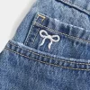 Curvy Low-Rise Embroidered Bow Denim Mini Skort
