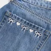 Curvy Low-Rise Embroidered Bow Denim Mini Skort