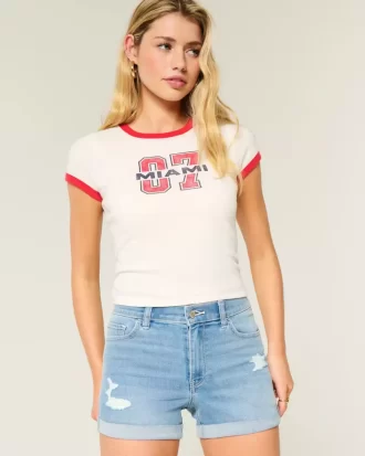 High-Rise Ripped Medium Light Wash Denim Shortie Shorts