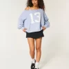 Hollister Comfy Cloud Easy Off-the-Shoulder Number Graphic Sweater Hollister Comfy Cloud Easy Off-the-Shoulder Number Graphic Sweater
