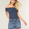 Low-Rise Medium Wash Flag Embroidered Denim Mini Skort