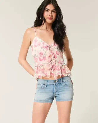 Low-Rise Medium Wash Studded Denim Shortie Shorts