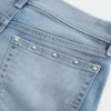 Low-Rise Medium Wash Studded Denim Shortie Shorts