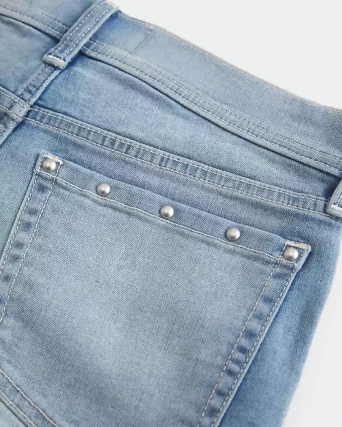 Low-Rise Medium Wash Studded Denim Shortie Shorts
