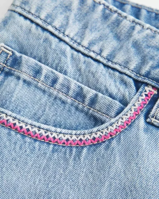 Low-Rise Pink Embroidered Light Wash Denim Mini Skort