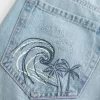 Low-Rise Ripped Light Wash Graphic Baggy Jeans