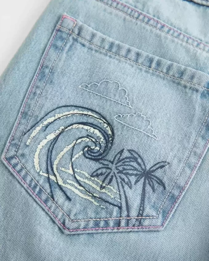 Low-Rise Ripped Light Wash Graphic Baggy Jeans