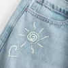 Low-Rise Ripped Light Wash Graphic Baggy Jeans
