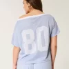 Oversized Off-the-Shoulder Varsity Graphic Jersey Oversized Off-the-Shoulder Varsity Graphic Jersey
