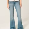 Ultra Low-Rise Medium Wash Flare Jeans