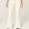 Ultra Low-Rise White Embroidered Pocket Flare Jeans