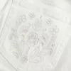 Ultra Low-Rise White Embroidered Pocket Flare Jeans